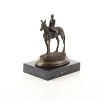 A BRONZE SCULPTURE OF A HORSE AND RIDER