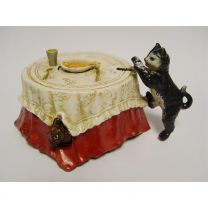 A CAST IRON CAT AND FISH MECHANICAL BANK